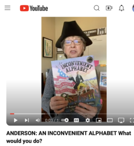Author Beth Anders with copy of book AN INCONVENIENT ALPHABET